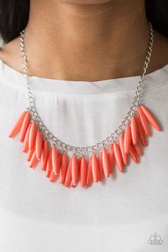 Polished and cloudy Living Coral beads cascade from the bottom of a shimmery silver chain, creating a colorful fringe below the collar. Features an adjustable clasp closure. Sold as one individual necklace. Includes one pair of matching earrings. Coral Beads Necklace, Orange Necklace, Living Coral, Fringe Necklace, Purple Rhinestone, Acrylic Jewellery, Free Earrings, Paparazzi Accessories, Black Necklace