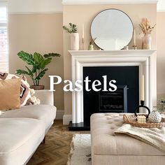 a living room filled with furniture and a fire place in front of a mirror on the wall