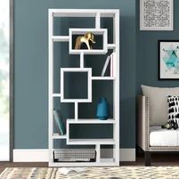 a living room with blue walls and a white bookcase