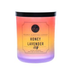 a candle that is sitting in front of a white background with the words honey lavender on it