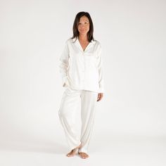 The Birdie Satin Pajamas are certain to become the most refined addition to your loungewear edit. These pajamas are made with luxurious, silky satin that washes beautifully. The button-front top has a notched collar and standard-length sleeves. These are the comfortable, relaxed PJs you’ll live in, gift to everyone, and pack with you wherever you go.Material: Poly-satin fabricSize & Fit: Fits for a more tailored style. Size up if in between sizes. 26.5" InseamCare guide: Machine wash cold with l Elegant Satin Sleepwear For Lounging, Elegant Satin Loungewear, Elegant Relaxed Fit Sleepwear For Pajama Party, Elegant Relax Fit Sleepwear For Pajama Party, White Silk Sleepwear For Bedtime, Luxury Silk Long Sleeve Sleepwear, Luxury Long Sleeve Silk Sleepwear, White Silk Long-sleeve Sleepwear, White Silk Long Sleeve Sleepwear