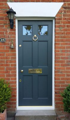 a blue front door with two sidelights