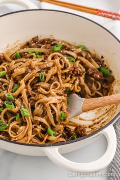 a skillet filled with noodles and ground beef