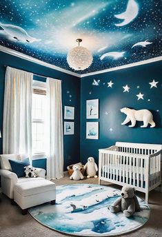 a baby's room decorated in blue and white with stars, clouds, and bears