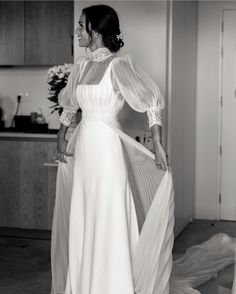 black and white photo of woman in wedding dress