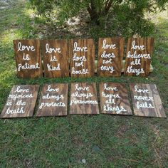 wooden signs that say love is patient, love does not always end up in the grass