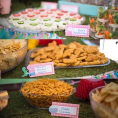 an assortment of snacks on display at a birthday party