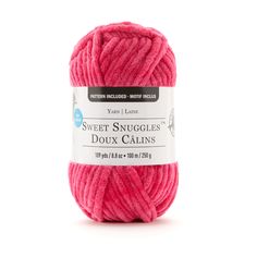 a ball of pink yarn with the label sweet snuggies dox calms