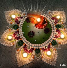 an artistic design with candles in the center