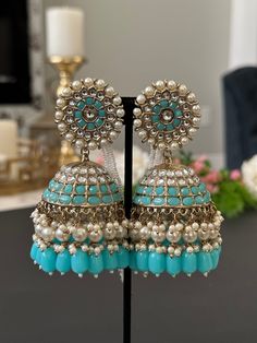 Lightweight jhumka earrings.  available in 2 colors- pearl, blue Earrings length- 4 inches Cheap Handmade Festive Jhumkas, Cheap Festive Jhumkas With Latkans, Blue Jhumkas With Latkans Drop Earrings, Blue Chandbali Jhumkas With Latkans, Blue Chandbali Jhumkas Bollywood Style, Blue Chandbali Bollywood Jhumkas, Blue Bollywood Chandbali Jhumkas, Anarkali Chandbali Earrings With Latkans, Chandbali Beaded Earrings With Latkans