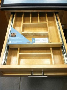 an open drawer is shown with drawers in it