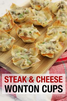 steak and cheese wonton cups on a wooden cutting board with red checkered napkin