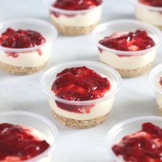 small desserts are arranged in plastic containers on a table