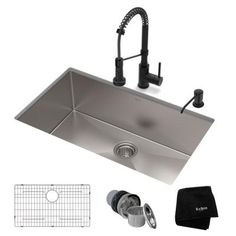 stainless steel kitchen sink with faucet and accessories