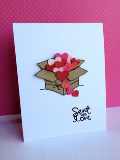 a greeting card with hearts in a box on a pink background that says sent to you