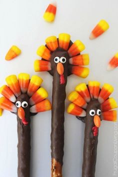 two turkey pretzels with candy sticks in the shape of heads