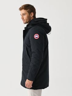 DESCRIPTION:The Langford Parka has been updated with a streamlined hood, additional pockets, and backpack straps. This stylish urban piece offers a longer length for protection, a storm flap, and interior pockets.FEATURES:Adjustable Tunnel HoodStand Up Collar, Tricot ChinguardRecessed Rib-Knit Cuffs4 Exterior Pockets3 Interior Pockets2-Way Zip Closure, Snap PlacketInterior Backpack StrapsWater-Repellent FinishInsulation: 625-Fill Power Responsibly Sourced Duck DownShell: 83% Polyester, 17% Cotto Classic Black Outerwear With Double-lined Hood, Casual Black Outerwear With Storm Flap, Urban Black Parka With Side Pockets, Functional Black Parka For Urban Adventures, Black Urban Parka With Side Pockets, Classic Black Travel Outerwear, Functional Travel Parka With Adjustable Hood, Black Winter Travel Parka, Black Travel Outerwear With Double-lined Hood