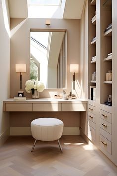 a white stool sitting under a window next to a bathroom vanity with a skylight