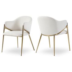 two white chairs sitting next to each other