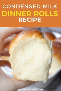 a hand holding a piece of bread with the words condenseed milk dinner rolls recipe