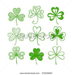 four leaf clovers in green and white colors on a white background stock photo 5379