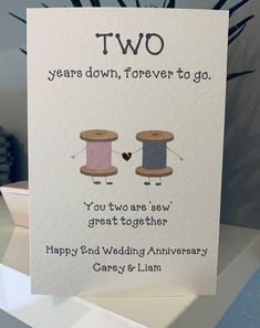 a card with two spools of thread on it and the words, two years down, forever to go you two are sew great together happy 2nd wedding anniversary care