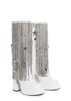 cuz you leave a trail of stardust. These platform boots have a vegan leather construction, platform soles, block heels, rhinestone fringe with star charms, elastic side panels, and side zipper closures. Futuristic Boots, Pink Superhero, Kpop Accessories, Rave Shoes, Dress Reference, Heels Rhinestone, Rhinestone Cowboy, Go Go Boots, Diamond Heels