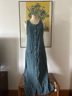 This amazing 100% cotton 90s dress is the perfect transitional dress. You can wear it in summer and also bring it into your fall wardrobe with some cowboy boots and a cute cardigan. It has two pockets in the front with velcro to close them, buttons all down the front and it's sleeveless. Size small (S). NO RETURNS. Relaxed Fit Cotton Maxi Dress For Day Out, Summer Cotton Maxi Dress With Relaxed Fit, Summer Cotton Relaxed Fit Maxi Dress, Relaxed Fit Cotton Maxi Dress For Summer, Fitted Cotton Maxi Dress For Picnic, Cotton Relaxed Fit Sundress Midi Dress, Fitted Cotton Midi Dress For Picnic, Casual Cotton Sundress, Relaxed Fit Cotton Sundress