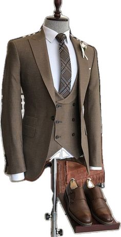 Carr Glamorous Coffee Peaked Lapel Three Pieces Business Suits Groom Suit Sets With Suit Collar And Buttons, Wedding Suits With Notch Lapel And Buttons, Classic Wedding Sets With Button Closure, Brown Semi-formal Suits, Double Breasted Suit With Single Button For Wedding, Tailored Wedding Blazer With Buttons, Wedding Three-piece Single-breasted Suit, Brown Three-piece Wedding Suit, Elegant Brown Wedding Blazer