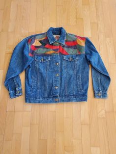 "Brand Blue Creek Jeans Amazing multicolored patchwork  denim trucker's jacket women's size medium (fits like a large) unisex size m/l (buttons on left so it's a women's but it's big for a medium oversized room fit) Nice condition has hand and chest pocket 80's or 90's vintage  Measurements: 21\" shoulder to shoulder 23\" sleeve 23\" pit to pit 46\" chest 40\" around waist at bottom hem adjustable  to be made smaller with button 26\" full length" Fall Patchwork Recycled Denim Jacket, Multicolor Denim Jacket For Fall, Fall Multicolor Denim Jacket, Retro Denim Patchwork Outerwear, Retro Patchwork Denim Jacket For Fall, Retro Patchwork Denim Jacket For Winter, Retro Winter Denim Jacket With Patchwork, Oversized 90s Denim Jacket For Fall, 90s Oversized Denim Jacket For Fall