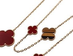 18k yellow gold Magic Alhambra 16 motif necklace by Van Cleef & Arpels, with carnelian and tiger's eye. Current retail $28000. Necklace comes in VCA pouch. DESIGNER: Van Cleef & Arpels MATERIAL: 18k Gold GEMSTONES: Tiger's eye, Carnelian DIMENSIONS: Necklace is 47.25" long. Clovers measure from 15 x 15mm to 25 x 25mm. MARKED/TESTED: VCA, 750, BL273***. WEIGHT: 62 grams CONDITION: Previously Owned, Excellent Condition. Luxury Gold Carnelian Jewelry, Luxury Carnelian Jewelry For Formal Occasions, Gold Carnelian Necklace For Formal Occasions, Elegant Carnelian Necklaces In Yellow Gold, Elegant Yellow Gold Carnelian Necklace, Luxury Brown Jewelry With Polished Finish, Luxury Red Necklaces, Elegant Brown Necklace With Polished Finish, Gold Magic