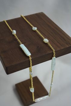 "Measurements: Keshi Pearl Size: 7mm,  Stick shape baroque pearl size: 22x6mm, Necklace length: 20\" Hand strung with stick shape baroque pearls and keshi pearl marrying elegance to earthiness. Wear it as an accent, layer it and  showcase it against your beachwear or evening attire. Material: 14k Gold Filled 14k gold filled is a strictly regulated process that involves pressure bonding multiple layers of solid 14k gold with extreme heat over a core of high quality jeweler's brass resulting in a durable, quality real gold product. Freshwater Pearl  Cultured freshwater pearls are farmed and created using freshwater mussels. We carefully select for our piece with great luster and quality. Every item is handcrafted. Shipping will be available within 3 days after your order been placed.  ------ Stick Pearl Necklace, Handmade Yellow Gold Necklaces With Baroque Pearls, Gold Baroque Pearl Long Necklace, Gold Long Baroque Pearl Necklace, Gold Pearl Necklace With Natural Stones For Wedding, Gold Pearl Necklace With Natural Stones, Freshwater Mussels, Keshi Pearl Necklace, Prom Gift