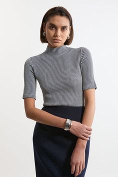 Feel Elevated In Our Knit Top, With A Universally Flattering, Fitted Silhouette, And A High, Funnel Neckline. Style This Piece With Jeans Or Tailored Trousers For An Outfit That Will Take You From Office Days To Wintery Walks, Then Pair With A Midi Skirt For More Elevated Occasions. Stripe Funnel Neck Short Sleeve Knit T-Shirt High Quality, Soft Knit Fabric High, Funnel Neckline Fine, Vertical Stripe Pattern Short, Flared Sleeves Comfortable, Figure Hugging Silhouette Striped Stretch Tops For Work, Stretch Striped Tops For Work, Chic Fitted Striped Tops, Knitted Short Sleeve Tops For Fall, Striped Stretch Turtleneck Top, Fitted Striped Knit Top, Striped Ribbed Knit Tops, Stretch Textured Knit Turtleneck Tops, Stretch Knitted Turtleneck Tops