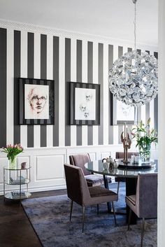 a dining room with black and white striped walls