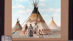 an old photo of people standing in front of teepees