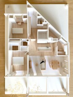 an overhead view of a model house with all the furniture and furnishings arranged in it