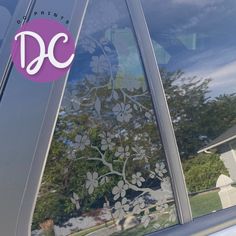 the side window of a car with a decal on it that says, d c