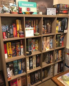 a bookshelf filled with lots of different types of books on top of it