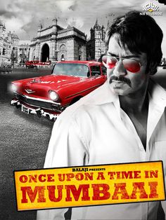 a man in white shirt and red eye glasses standing next to a red car with the words once upon a time in mumbai