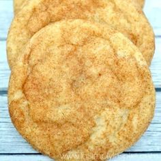 three cookies sitting on top of a wooden table