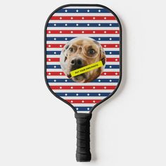 a tennis racket with a dog's face on it