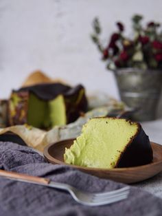 a piece of cake sitting on top of a wooden plate