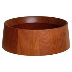 a wooden bowl is shown against a white background