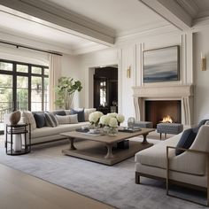 a living room filled with furniture and a fire place