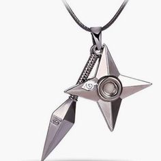 a silver necklace with a star shaped object hanging from it's center, on a white background