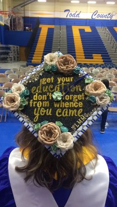 a person wearing a graduation cap with flowers on it