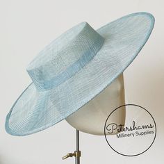 Boaters are all the rage, and this light blue sinamay fascinator version has us all in a twirl! Made from 2 layers of stiffened sinamay, these boaters are ready to trim and have a petersham ribbon on it's inside edge. Simply add a comb or headband to secure to the head.Hat base measures:Width: 37cm (14.5 inches)Crown Width: Measures 15.5cm (6.1 inches) wide at base and 14cm (5.5 inches) at top Crown Height: 4.5cm (1.7 inches)For even more millinery supplies you can find us here:www.etsy.com/shop Adjustable Flat Cap Hats For Summer, Light Blue Curved Brim Hat For Summer, Light Blue Summer Hat With Curved Brim, Light Blue Curved Brim Summer Hat, Fitted Flat Cap For Summer, Adjustable Blue Costume Hats With Curved Brim, Adjustable Blue Boater Hat For Summer, Adjustable Flat Brim Fascinator For Spring, Adjustable Short Brim Boater Hat For Church