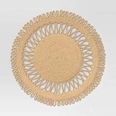 a round placemat made out of jute and woven with circles on the center