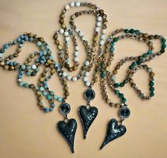 These beautiful handmade, knotted crystal and stone necklaces would be a perfect addition to your jewelry collection. Each are adorned with a black rhinestone pendant and hammered metal heart. The necklace is approximately 30 inches. Hammered Metal Jewelry, Turquoise Heart Necklace, Stone Necklaces, Turquoise Heart, African Turquoise, Hammered Metal, Metal Heart, Black Rhinestone, Stone Necklace