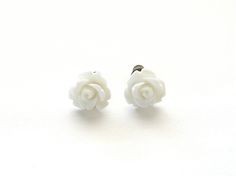 "These vintage style pretty little white rose earrings are simple, beautiful, and handmade for you. The tiny roses measure 10mm across and are held in place with push-on backs. The posts are made of antique brass and are nickle free. Perfect for pulling an outfit together, they go with everything! Rose measures: 10mm or 3/8\" Choose Antiqued Brass Post, Gold Plate over Stainless Steel, Hypoallergenic Surgical Steel or Silver Plate Post in the drop down menu. Other colors available. ♥ All items c White Classic Flower Earrings For Pierced Ears, Classic White Flower Earrings For Pierced Ears, White Classic Flower Earrings, Classic White Flower Earrings, White Flower-shaped Earrings With Rose Design, White Minimalist Nickel-free Flower Earrings, White Flower Earrings With Rose Design, Wedding Earrings Studs, Earrings White